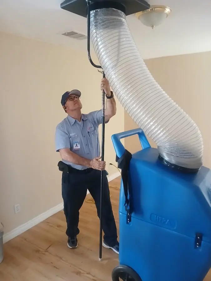 Furnace Tune-Up technician using HEPA equipment in Shady Hollow